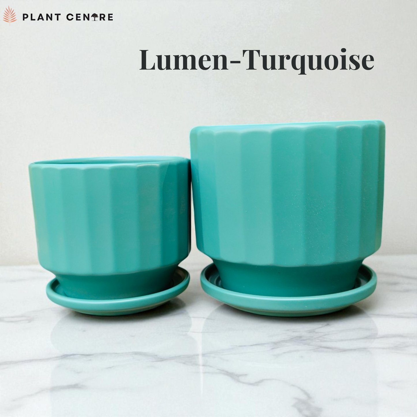 Two turquoise plant pots with saucers on a marble surface, branded 'Plant Centre'.