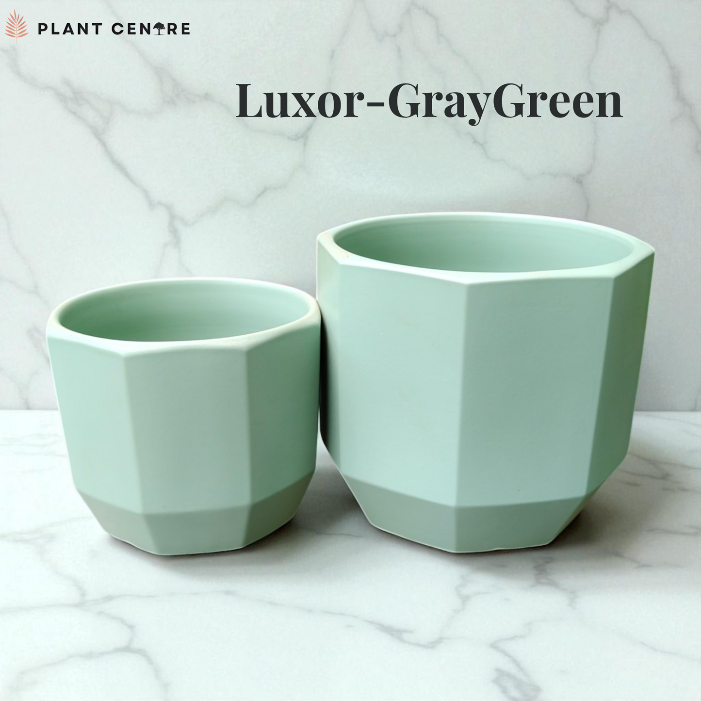 Two light green geometric plant pots on a marble surface with 'Plant Centre' branding.