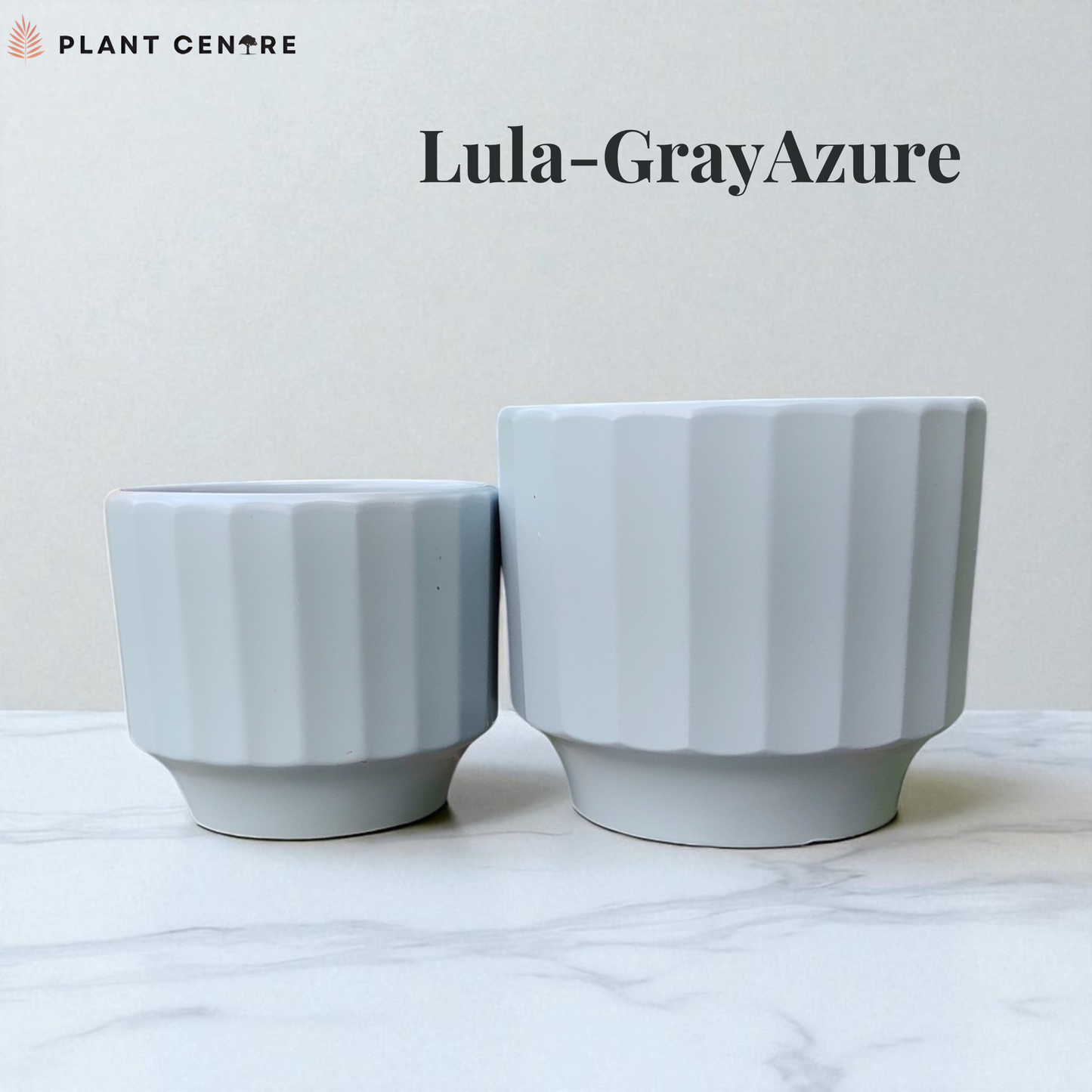 Two white ribbed plant pots on a marble surface with 'Lula-GrayAzure' text and 'Plant Centre' logo.