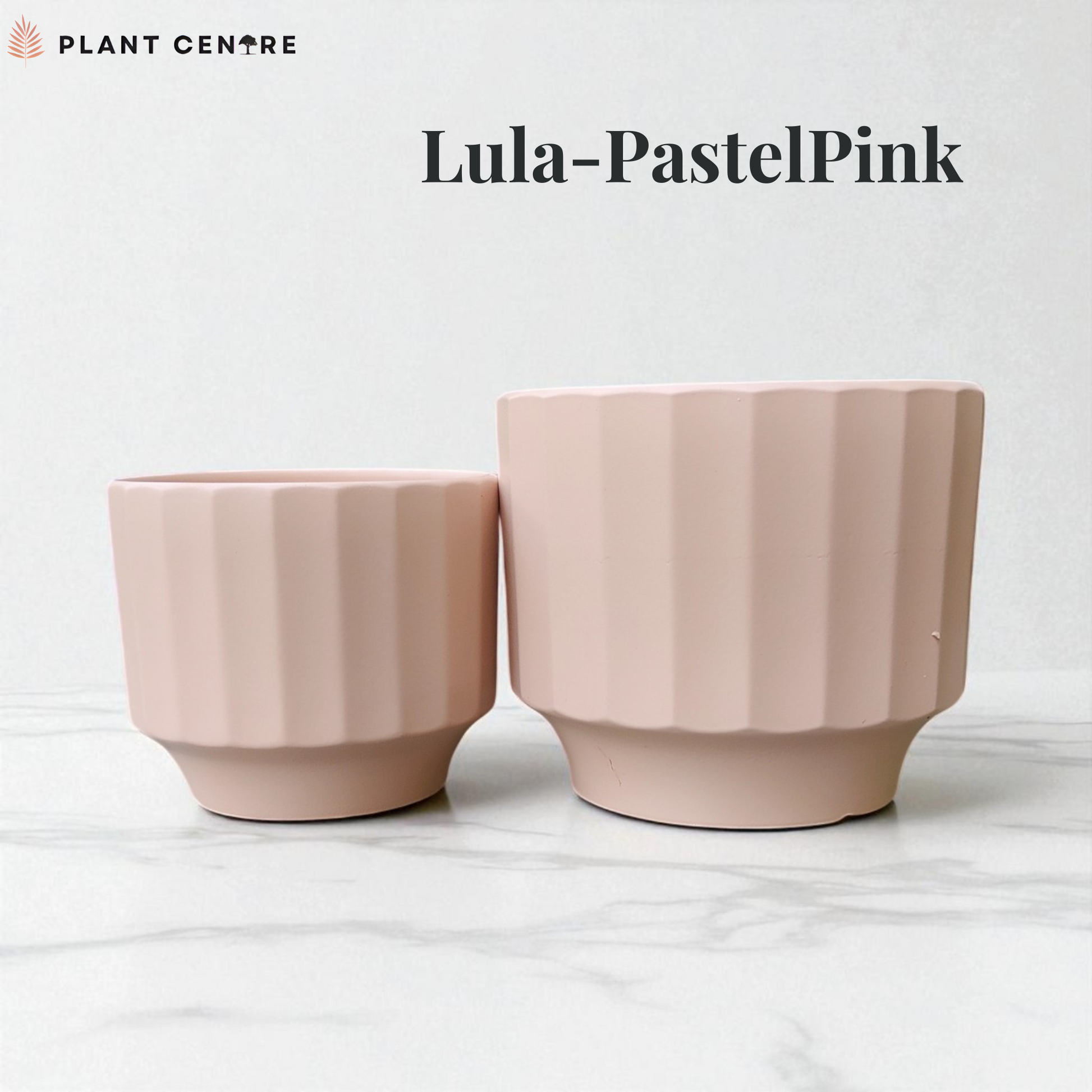 Two pastel pink plant pots on a white background with 'Plant Centre' branding.