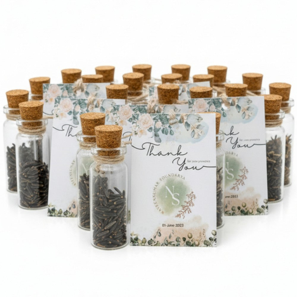Set of small glass jars with cork lids containing tea leaves, arranged on a white background.