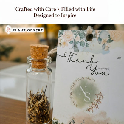 Glass bottle with cork lid containing dried plants next to a decorative 'Thank You' card with floral design and branding text.